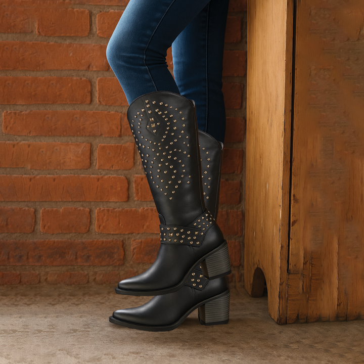 Rich brown vegan leather western knee-high boots with pointed toe and studded accents