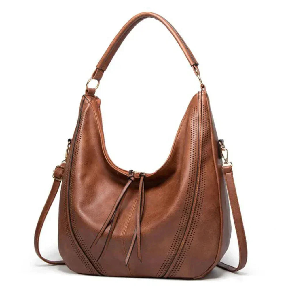 Wavlynn Jean vegan leather slouchy hobo bag in neutral tone with perforated detailing and adjustable strap