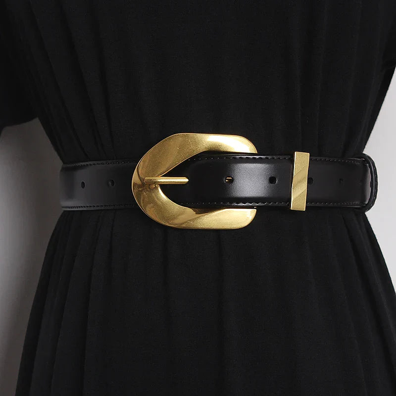 Black vegan leather waistband belt with polished oversized statement buckle, bold adjustable fit