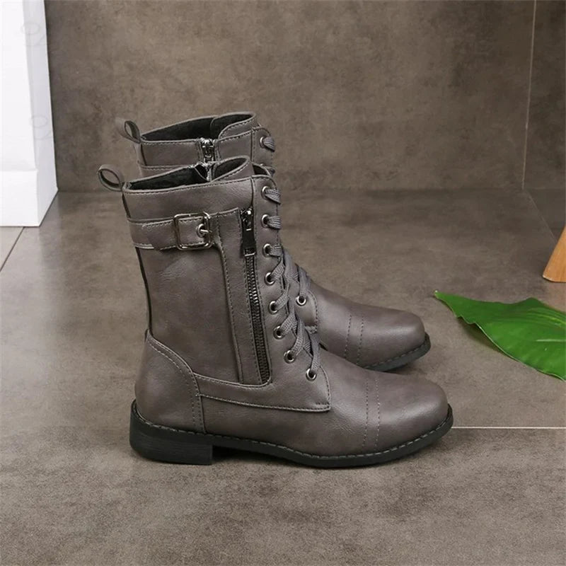 Women's brown textured leather mid-calf boots with refined silhouette and scuff-resistant premium finish