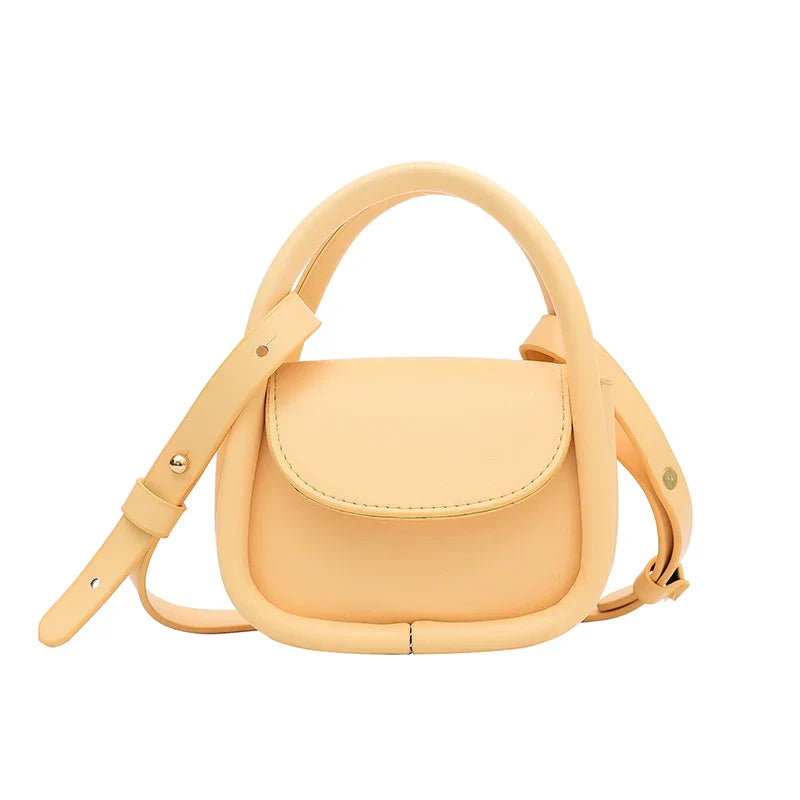 Wavlynn tan genuine leather crossbody bag with adjustable strap and snap-flap closure