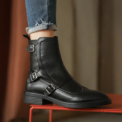 Women's black vegan leather Chelsea boots with elastic side panels and sleek pointed toe