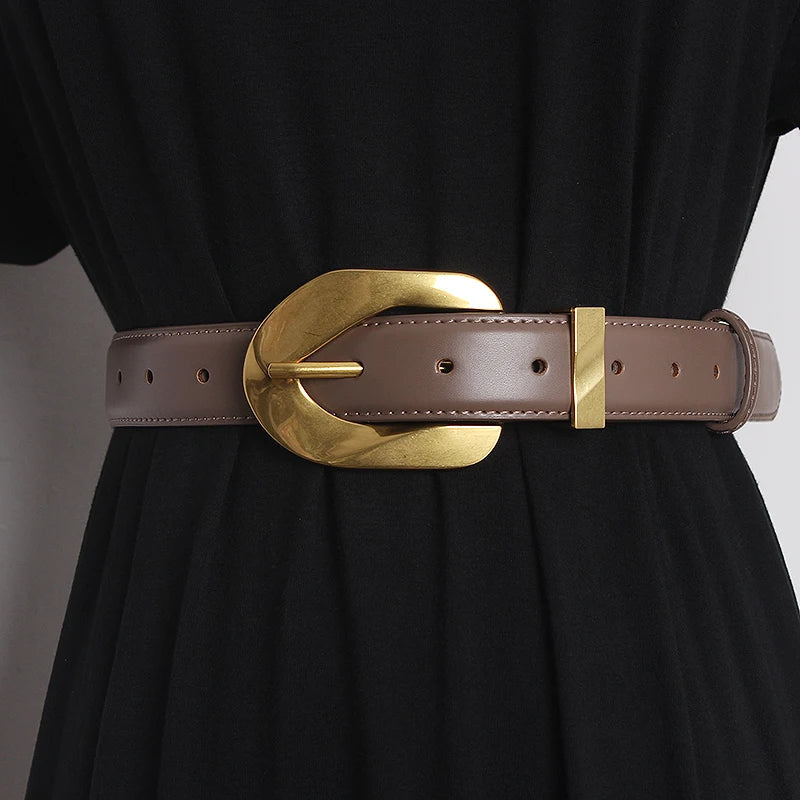 Black vegan leather waistband belt with polished oversized statement buckle, bold adjustable fit