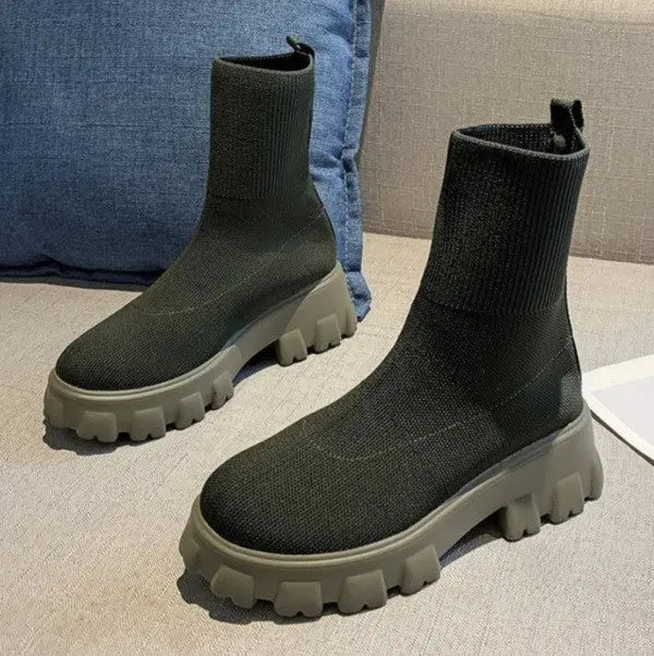 Women's black high-top sock boots with platform sole and sleek stretch-fit silhouette