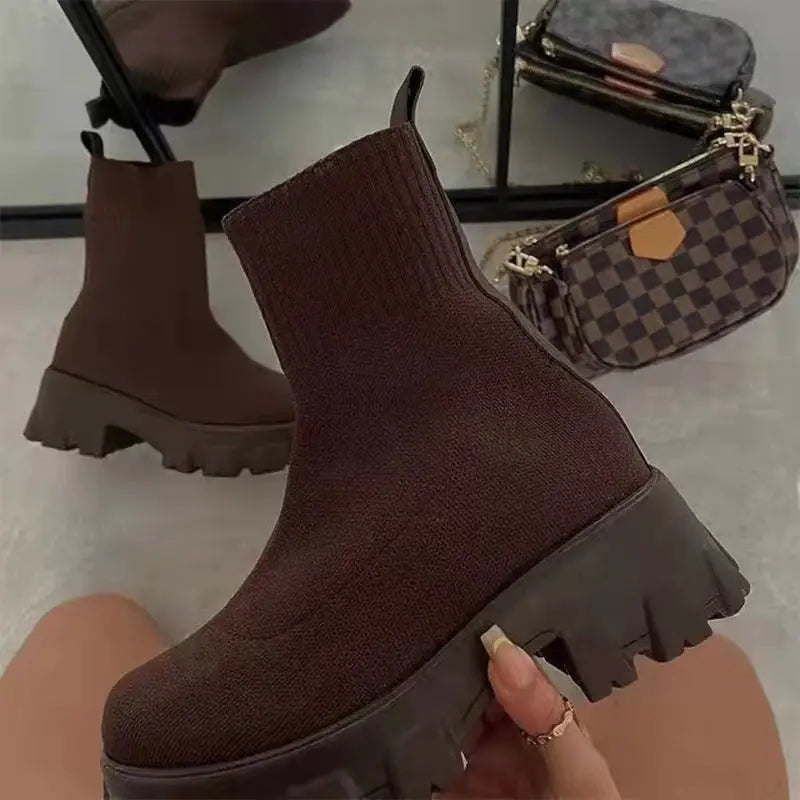 Women's black high-top sock boots with platform sole and sleek stretch-fit silhouette