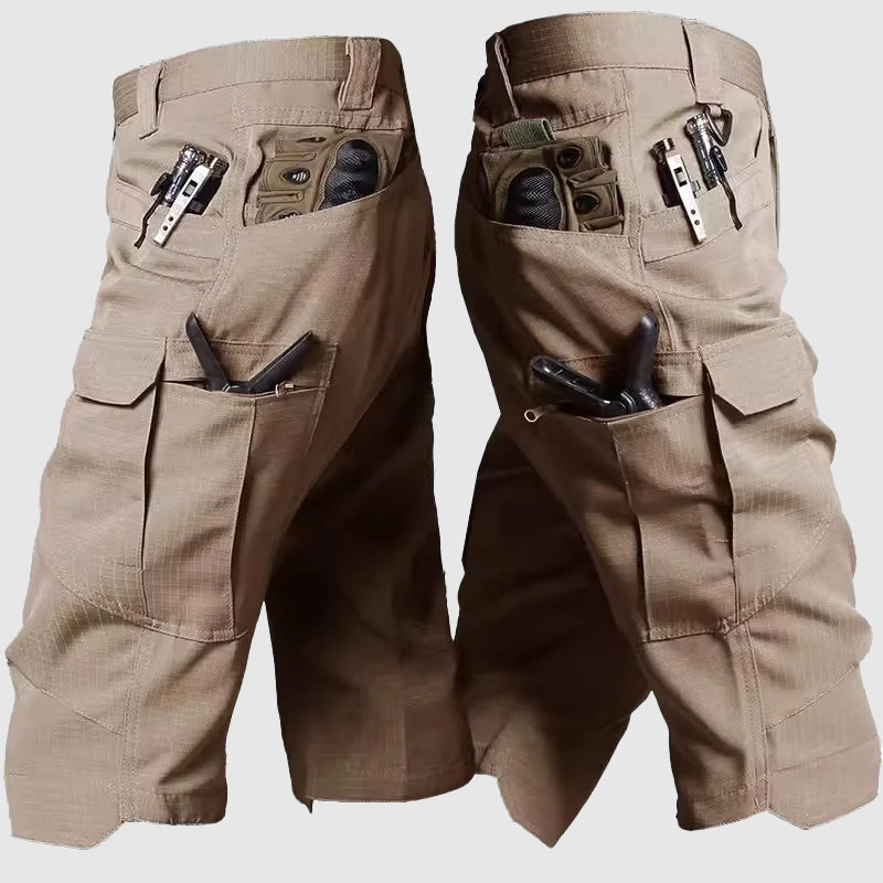 Men's green camo cargo shorts with zipper fly and multi-pocket design for outdoor adventures