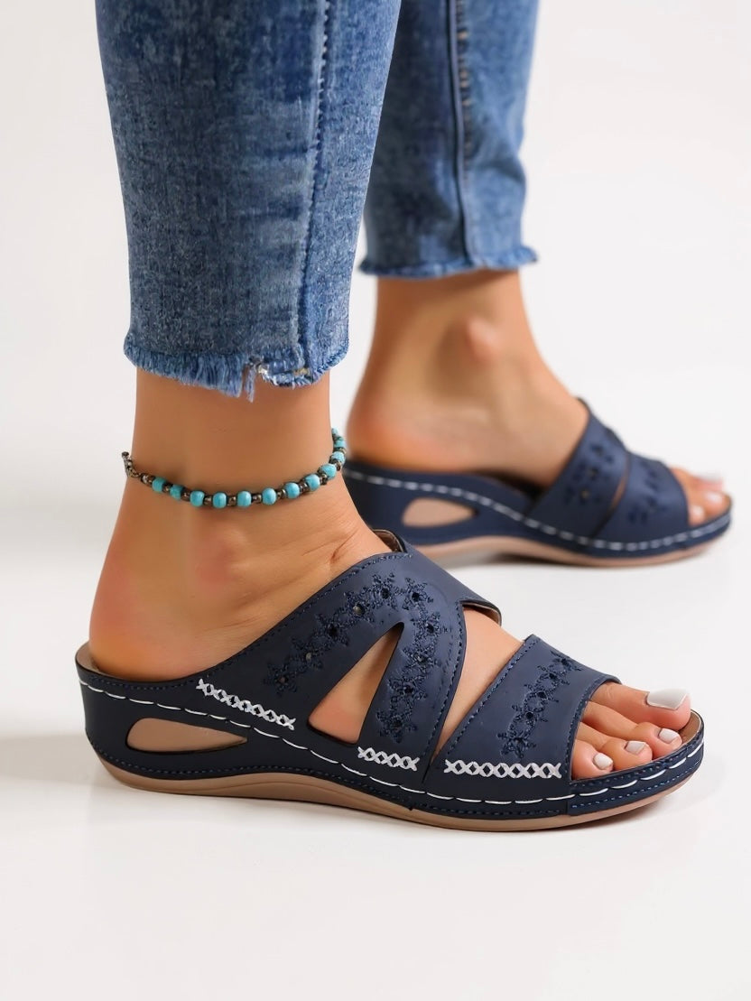 Women's cushioned slip-on slide sandals with intricate embroidery detail for effortless everyday elegance