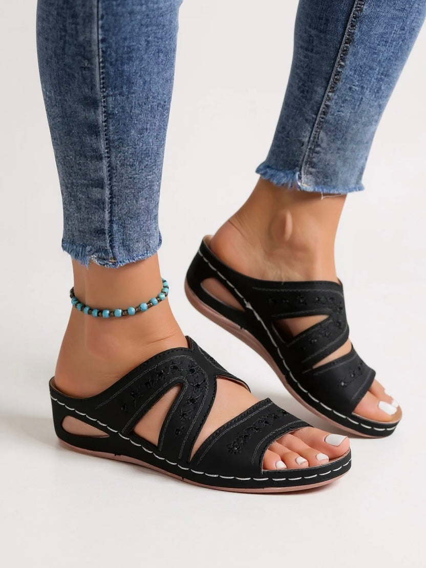 Women's beige cushioned slip-on slide sandals with intricate floral embroidery detailing