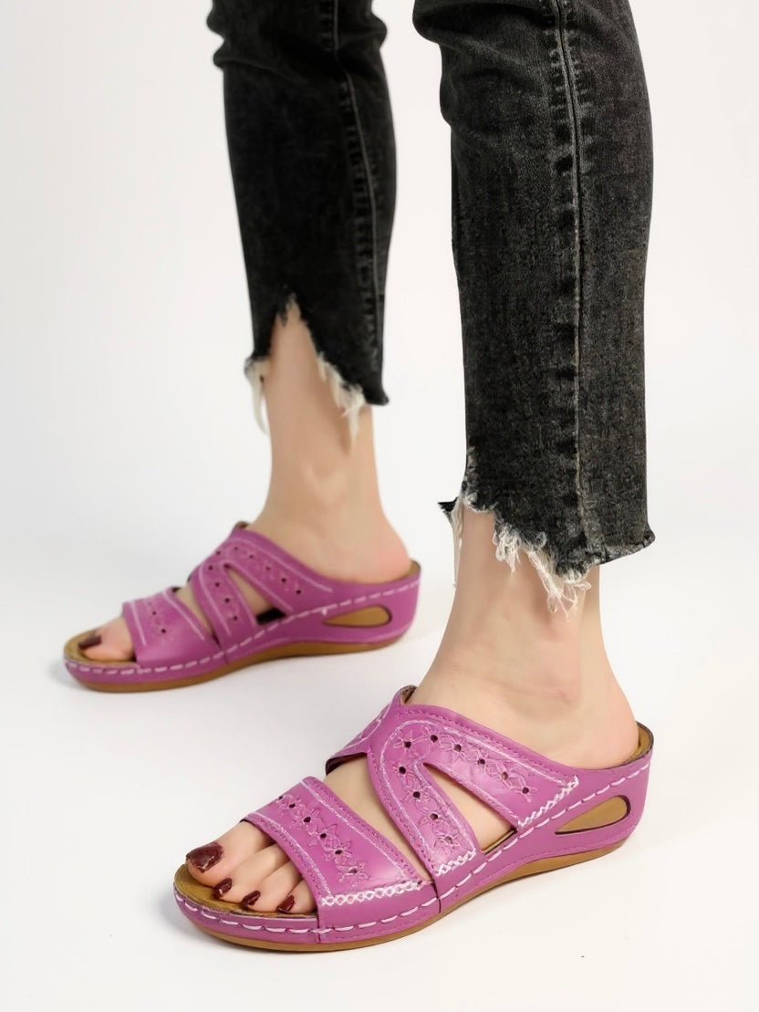 Women's cushioned slip-on slide sandals with intricate embroidery detail for relaxed everyday elegance