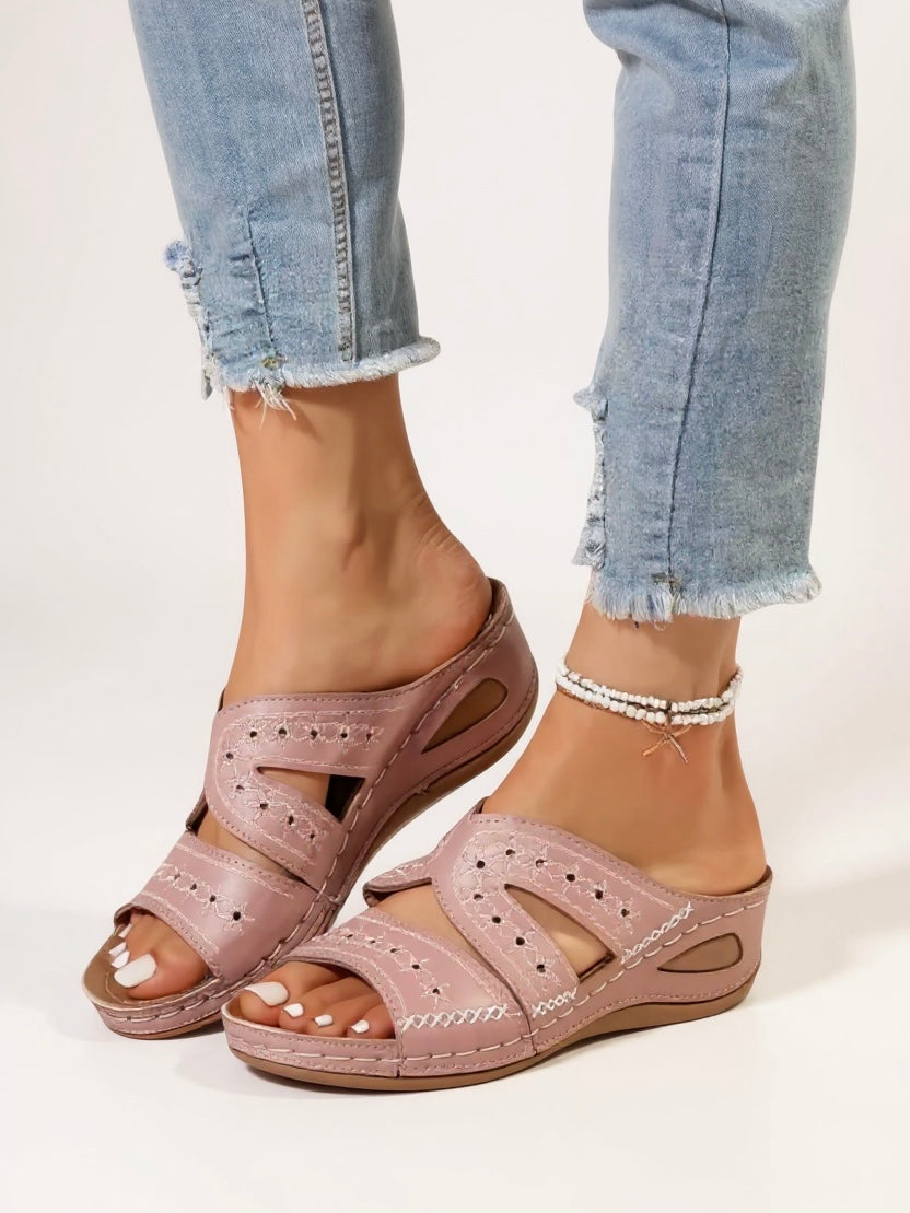 Women's cushioned slip-on slide sandals with intricate embroidery detail for relaxed elegance