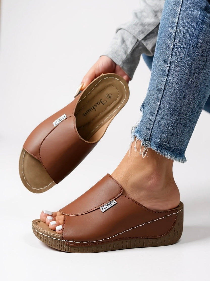 Women's minimalist platform cushioned slides in heather tone with contoured footbed and sleek sole