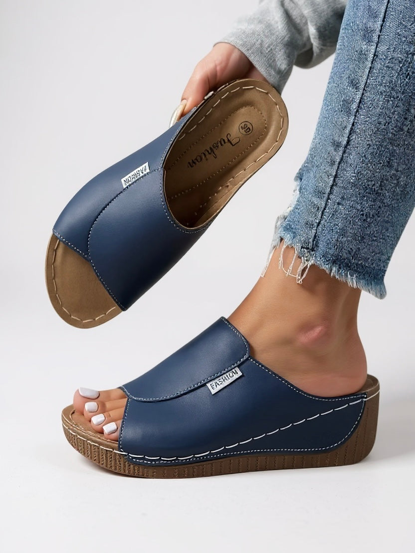 Women's platform cushioned slides in minimalist style with contoured footbed and lightweight sole