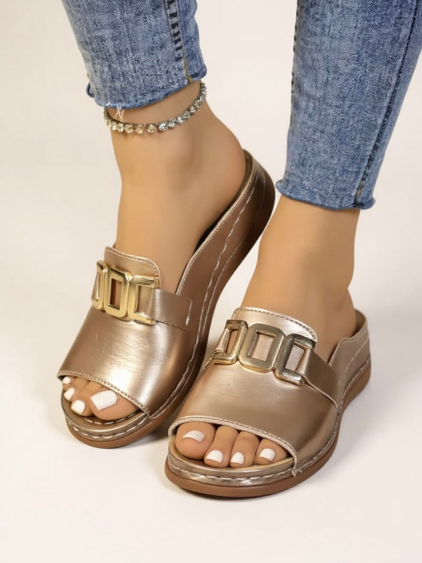 Women's cushioned slides with gold buckle accent, minimalist silhouette, soft footbed, effortless luxury style