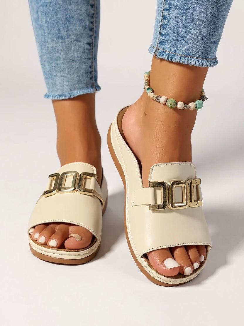 Women's cushioned slides with gold buckle accent, minimalist silhouette for effortless luxury style