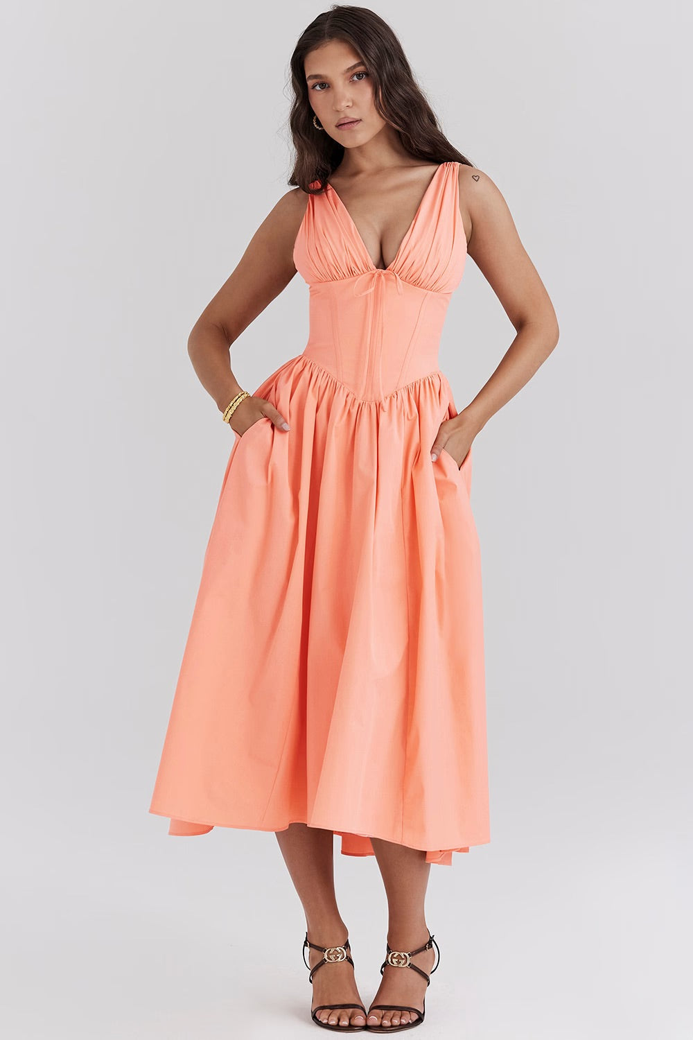 Saffron yellow women's wedding guest midi dress flowy feminine silhouette waist-defining summer 2026