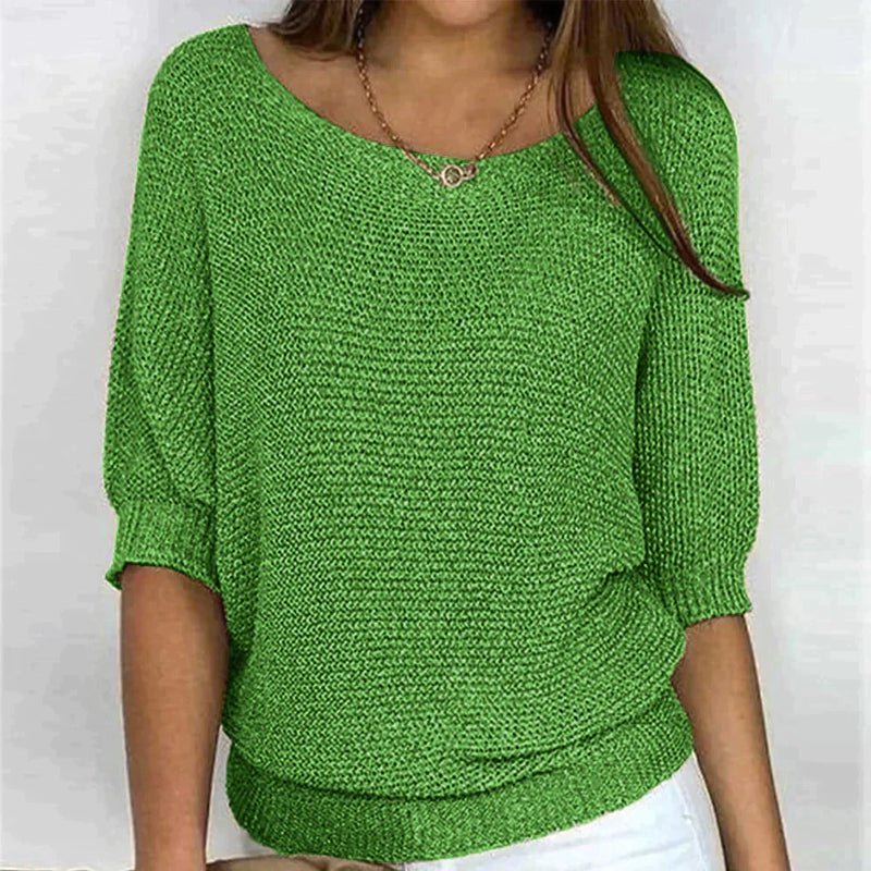 Beige loose knit pullover with wide neckline, half sleeves, and textured relaxed-fit design