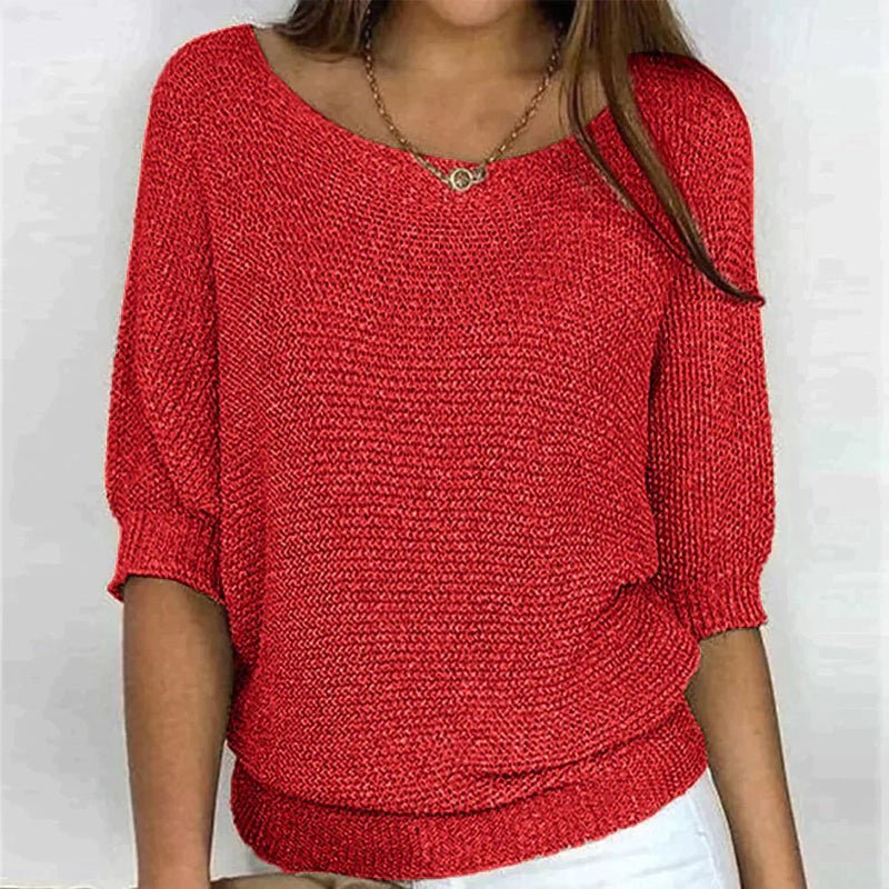 Beige loose knit pullover with wide neckline, half sleeves, and textured relaxed-fit design
