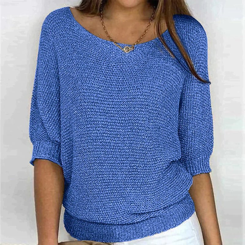 Beige loose knit pullover with wide neckline, half sleeves, and textured relaxed-fit design