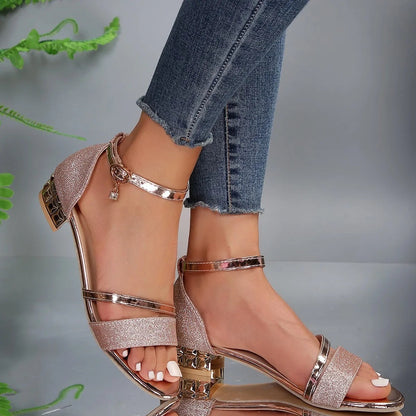 Women's suede-like open toe sandals with ankle buckle strap, low block heel, and metallic accents