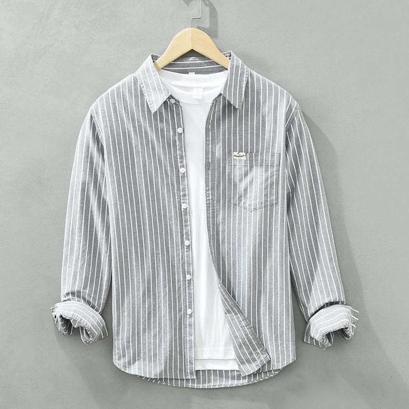 Men's white and blue vertical striped casual shirt with modern relaxed fit and button-down collar