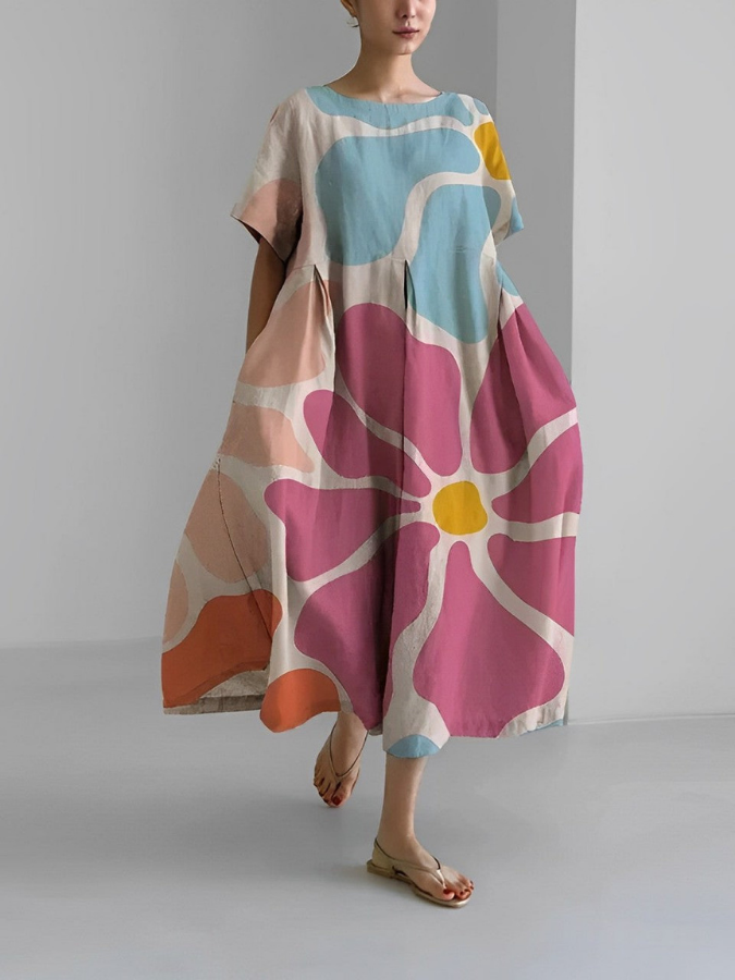 Flowy floral summer dress with flattering relaxed cut and vibrant botanical print for effortless style