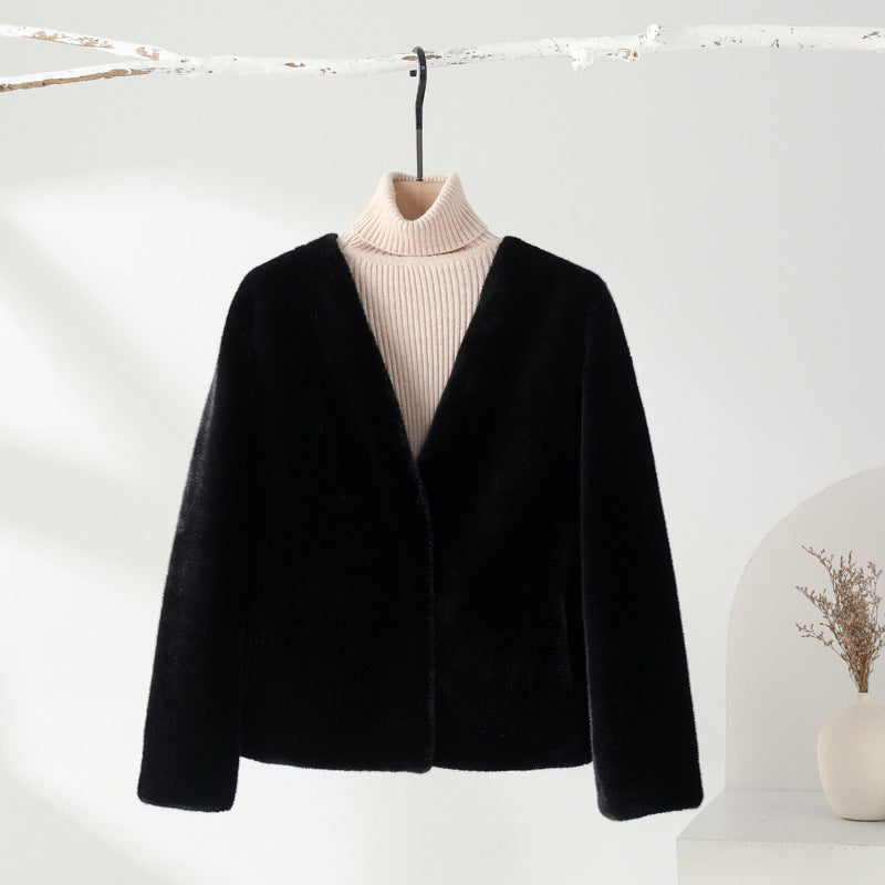 Burgundy velvet avant-garde coat by Sofia Amoretti with sophisticated structured silhouette