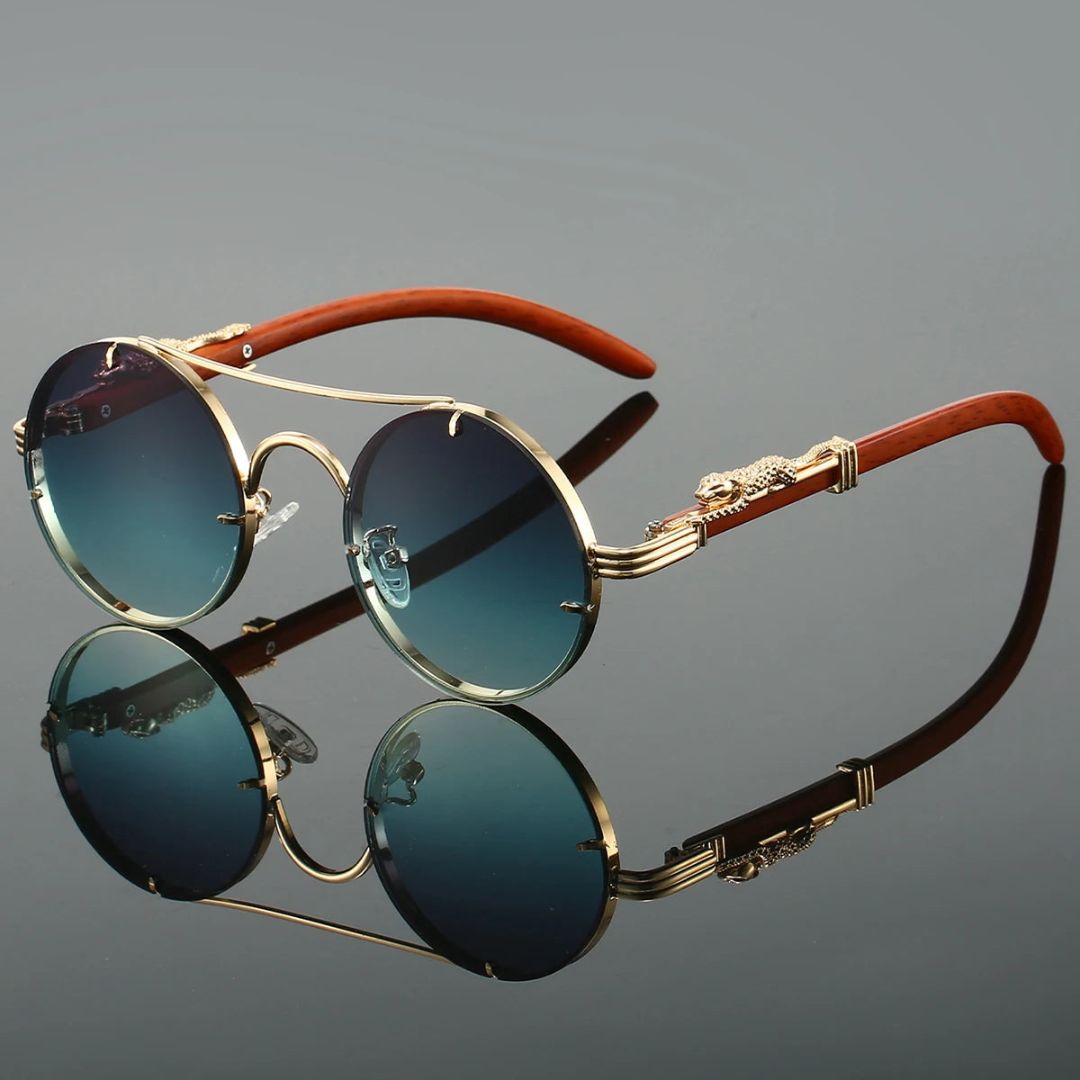 Gold vintage-style cat-eye sunglasses with panther embellishments and UV400 gradient lenses