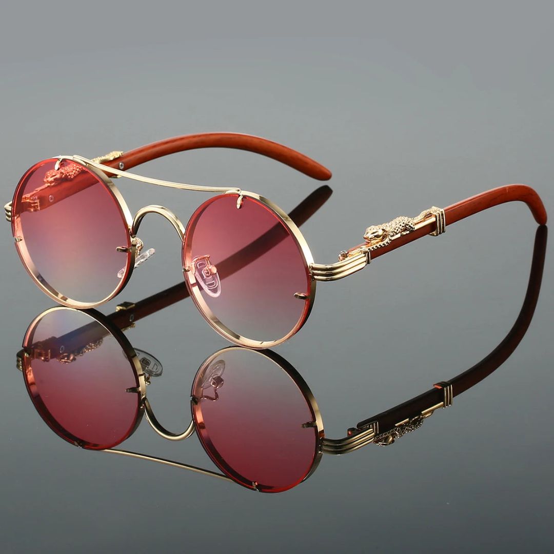Gold-framed vintage sunglasses with panther embellishments and UV400 gradient lenses for bold elegance