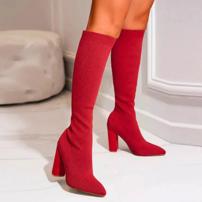 Women's black knee-high heeled boots with sleek form-fitting shaft for winter elegance