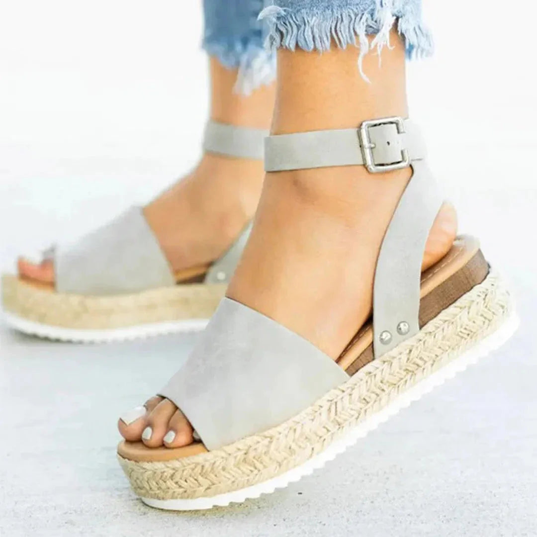 Women's beige espadrille platform sandals with adjustable ankle strap and braided jute-wrapped sole