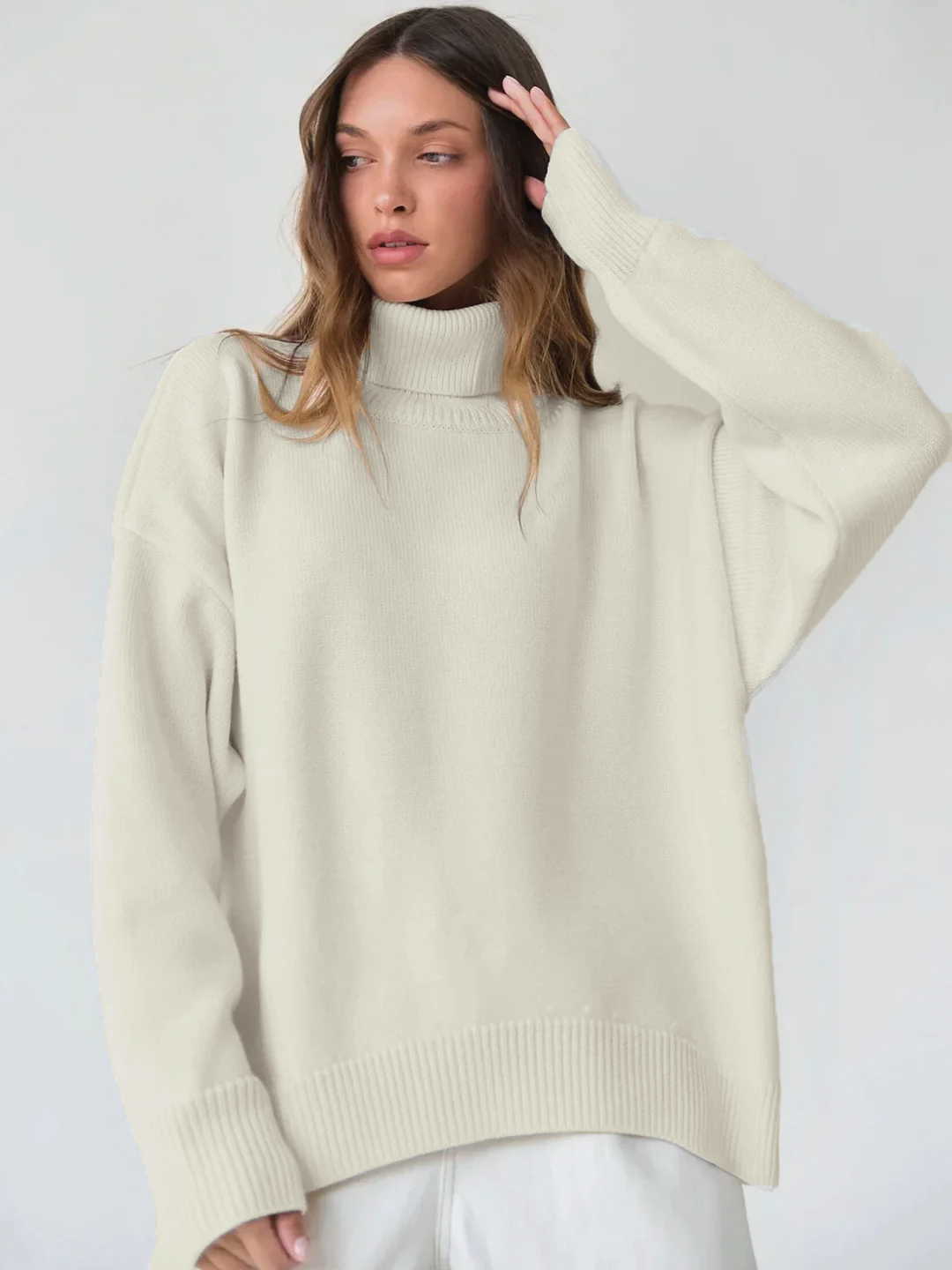 Arya oversized cream turtleneck sweater with ribbed knit texture and relaxed cozy silhouette