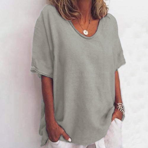 White linen-look relaxed T-shirt with dropped shoulders, side slits, and round neckline