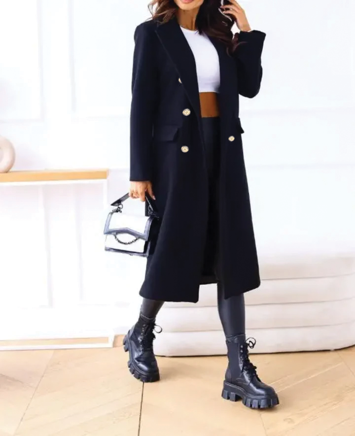 Beige fitted double-breasted trench coat with notched lapel and tailored silhouette