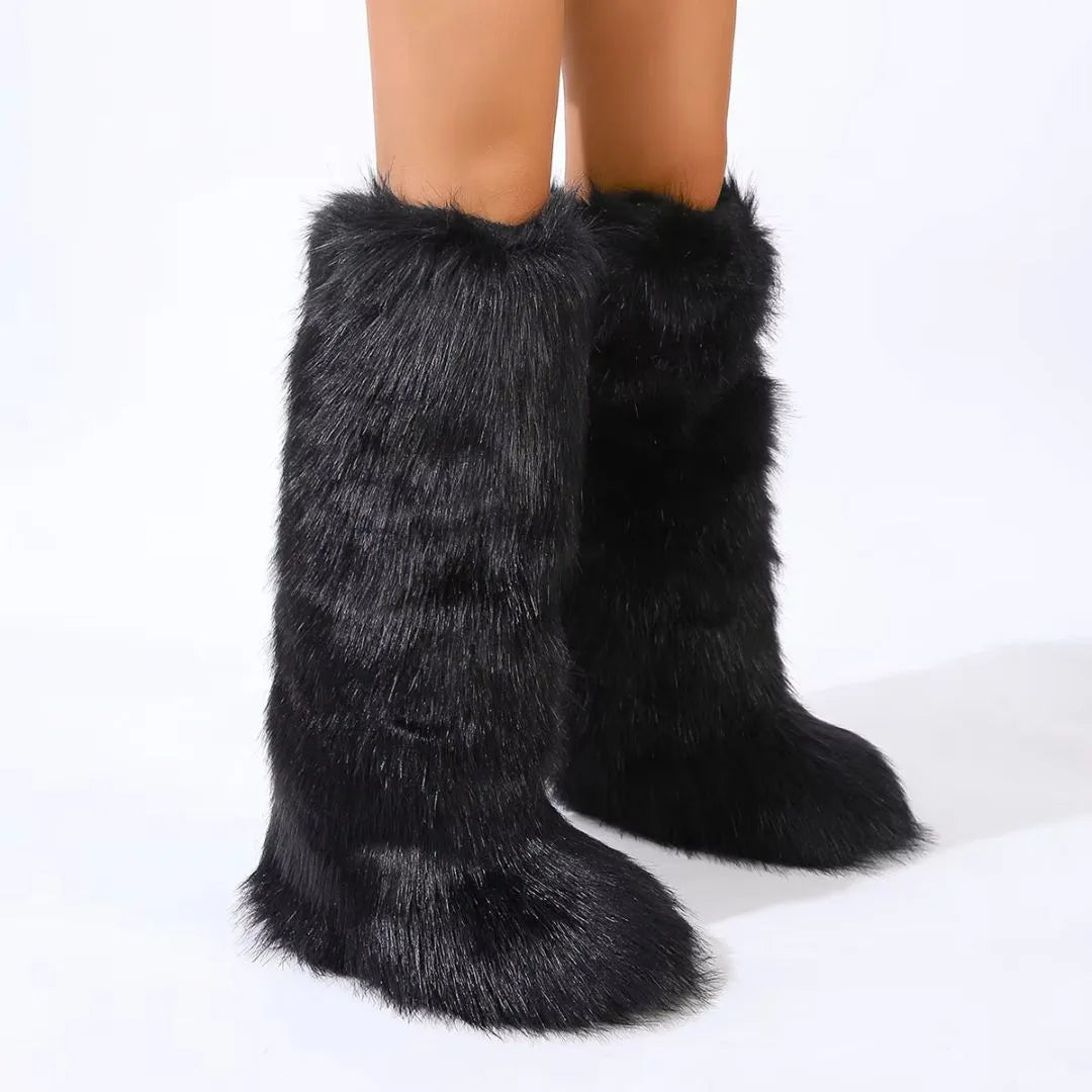 Knee-high faux fur boots with rounded toe, flared shaft, and slip-on design in bold statement style