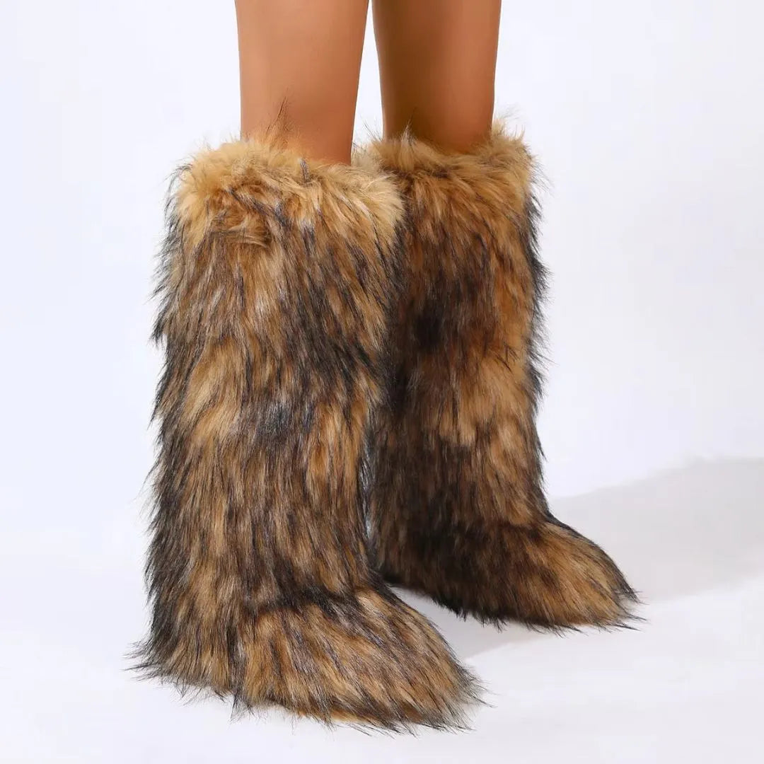 Knee-high faux fur slip-on boots with rounded toe and flared shaft in cozy wild style
