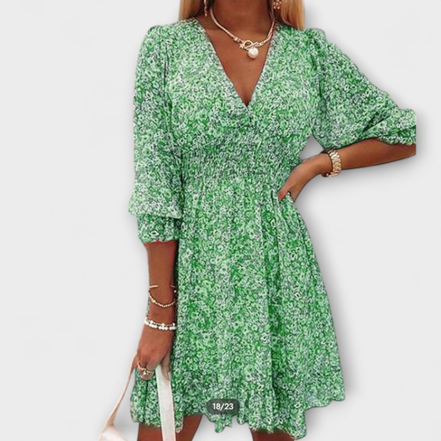 Women's floral puff sleeve midi dress in soft pastel tones with flowing silhouette