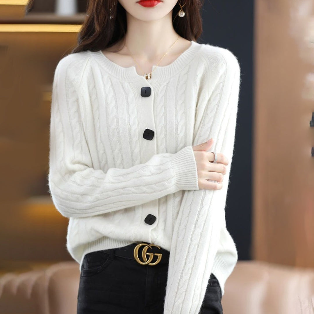 Women's relaxed fit cable knit cardigan with bold buttons, cozy winter style in neutral tones