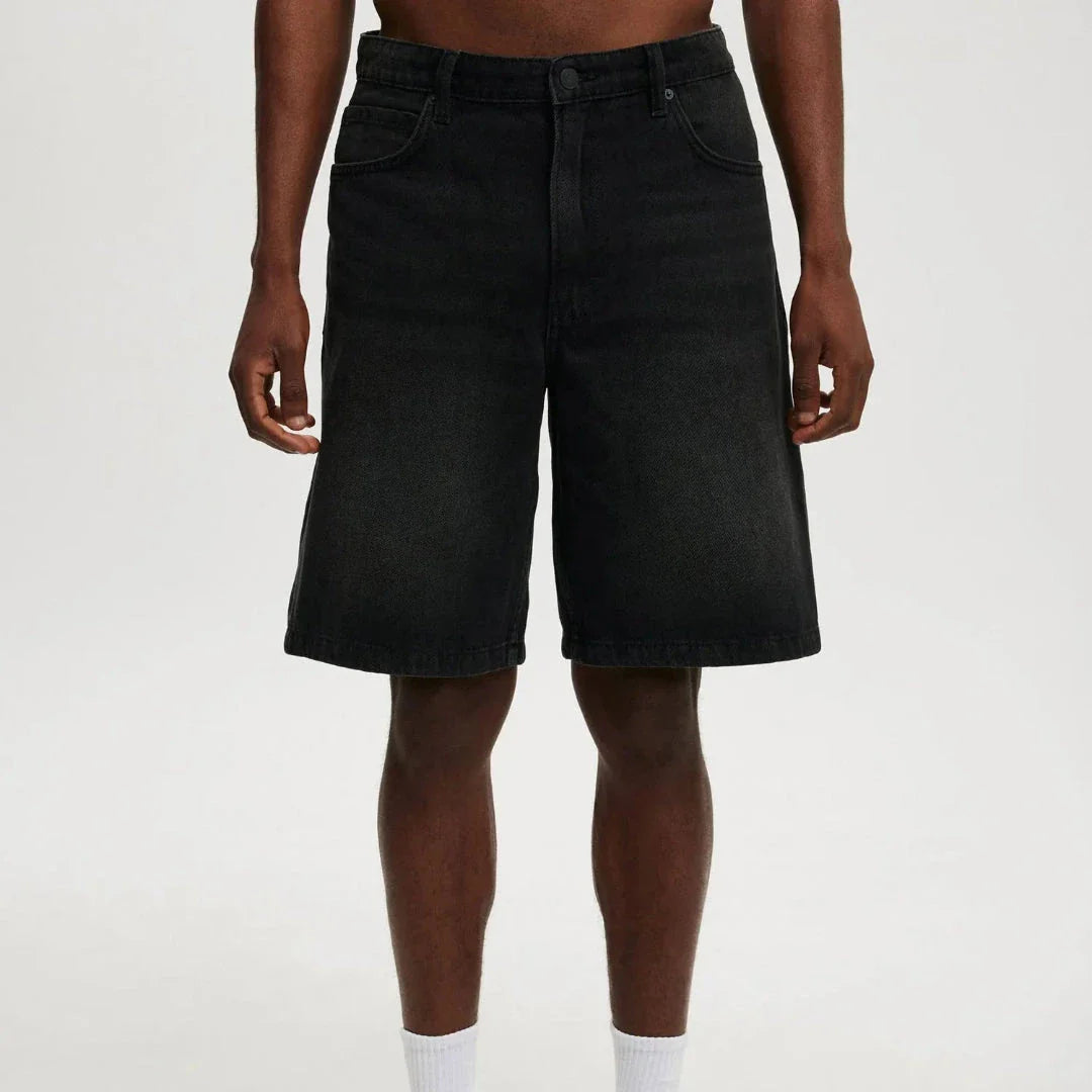 Men's relaxed fit knee-length denim shorts in vintage faded wash with classic 5-pocket design