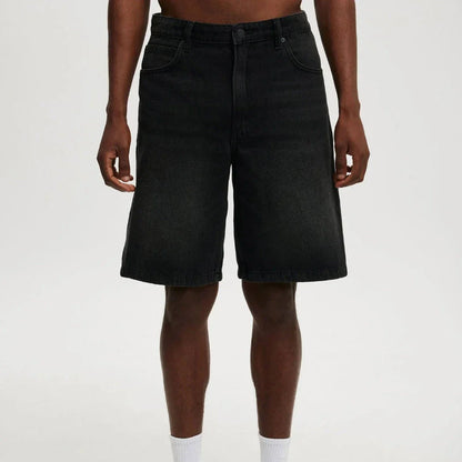 Men's relaxed fit knee-length denim shorts in vintage faded wash with classic 5-pocket design