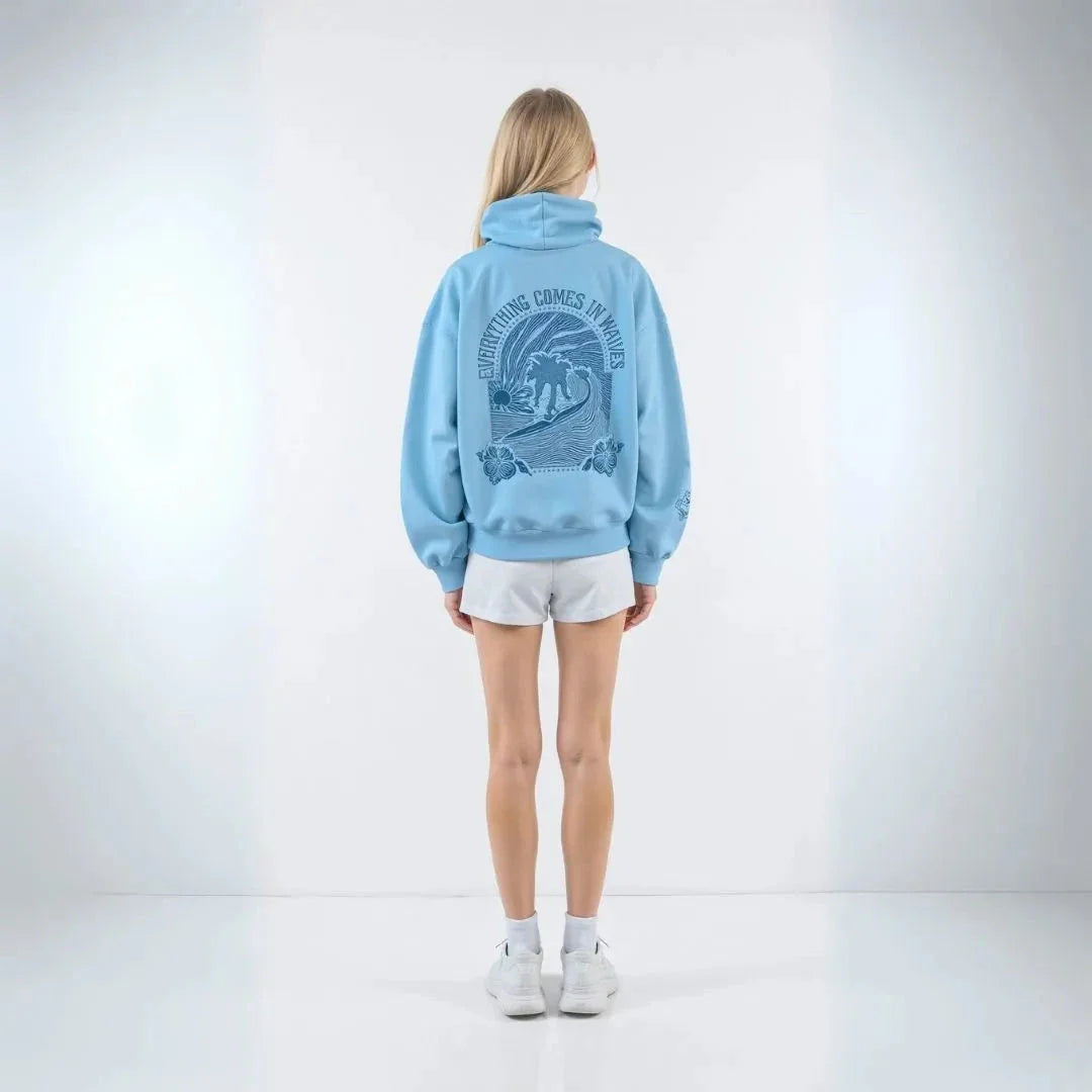 Wavlynn Kai oversized cream hoodie with palm tree print and Everything Comes in Waves motto graphic