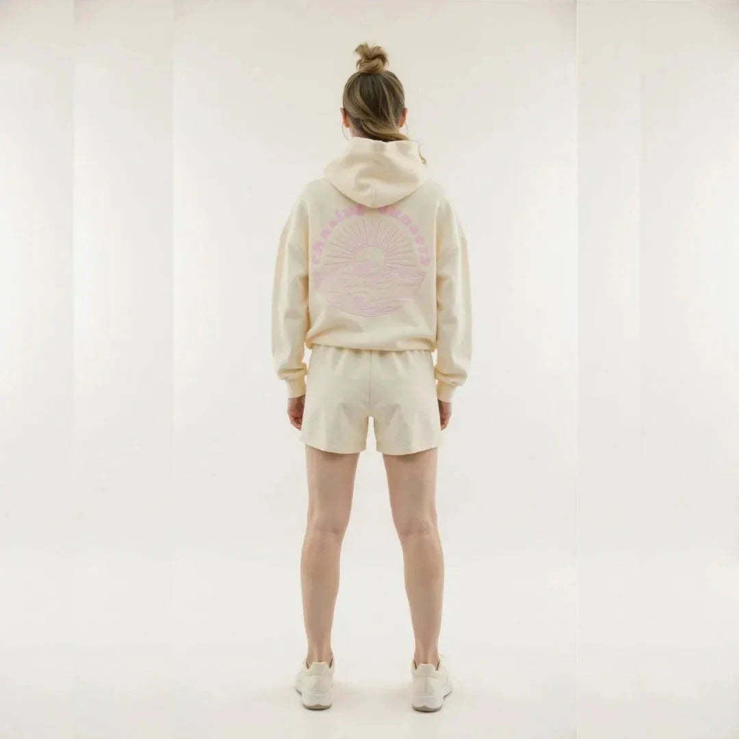 Wavlynn Kai oversized cream hoodie with tropical palm tree print and wave motto graphic