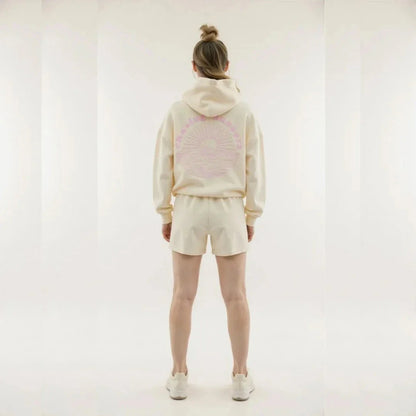 Wavlynn Kai oversized cream hoodie with tropical palm tree print and wave motto graphic