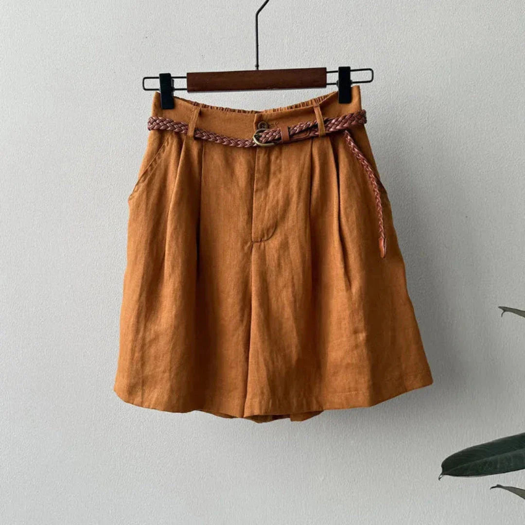 Beige high-waisted linen shorts with braided belt, flattering wide-leg summer cut