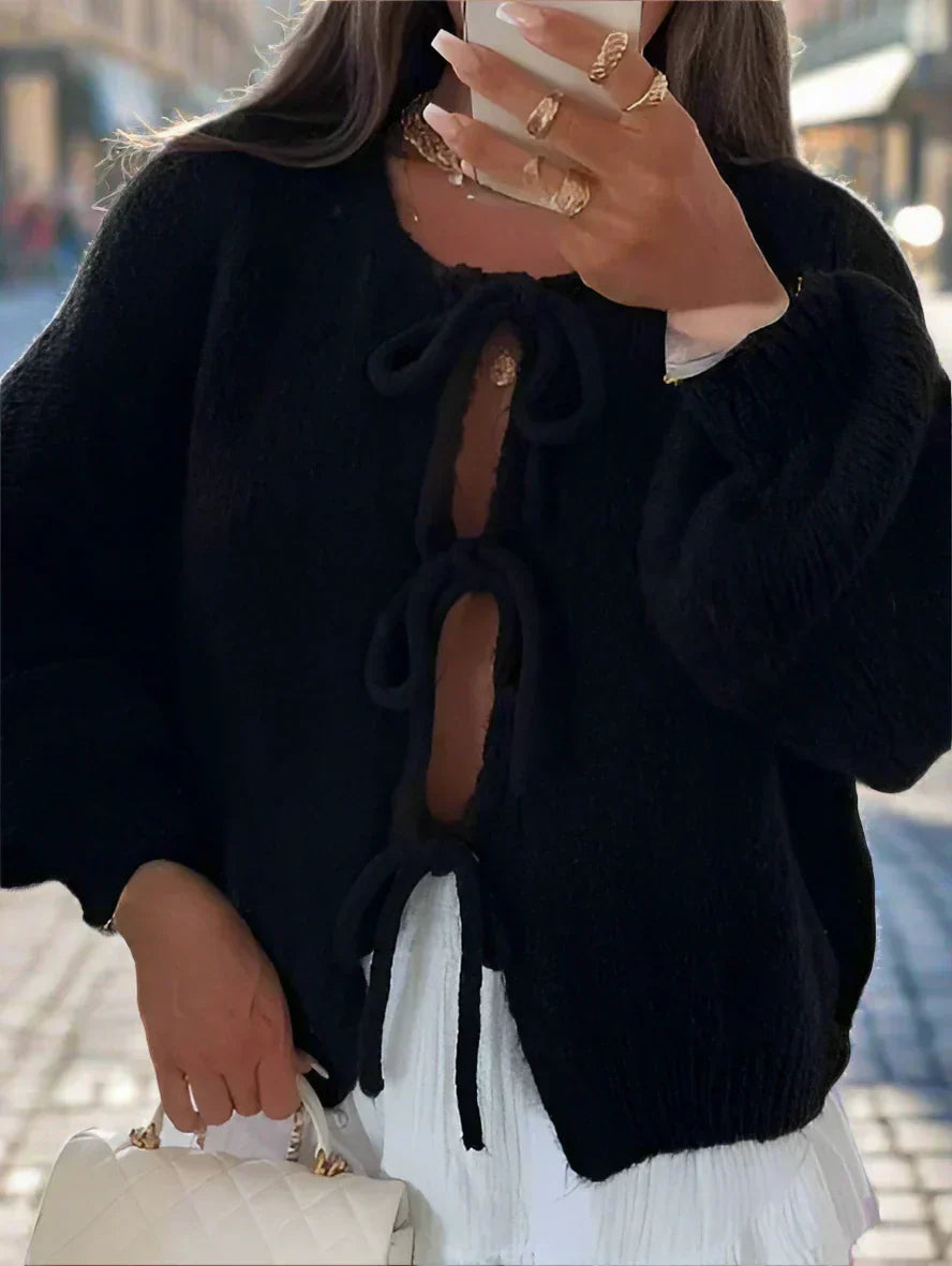 Women's chunky knit cardigan in cozy winter style with knotted front tie detail for flattering fit