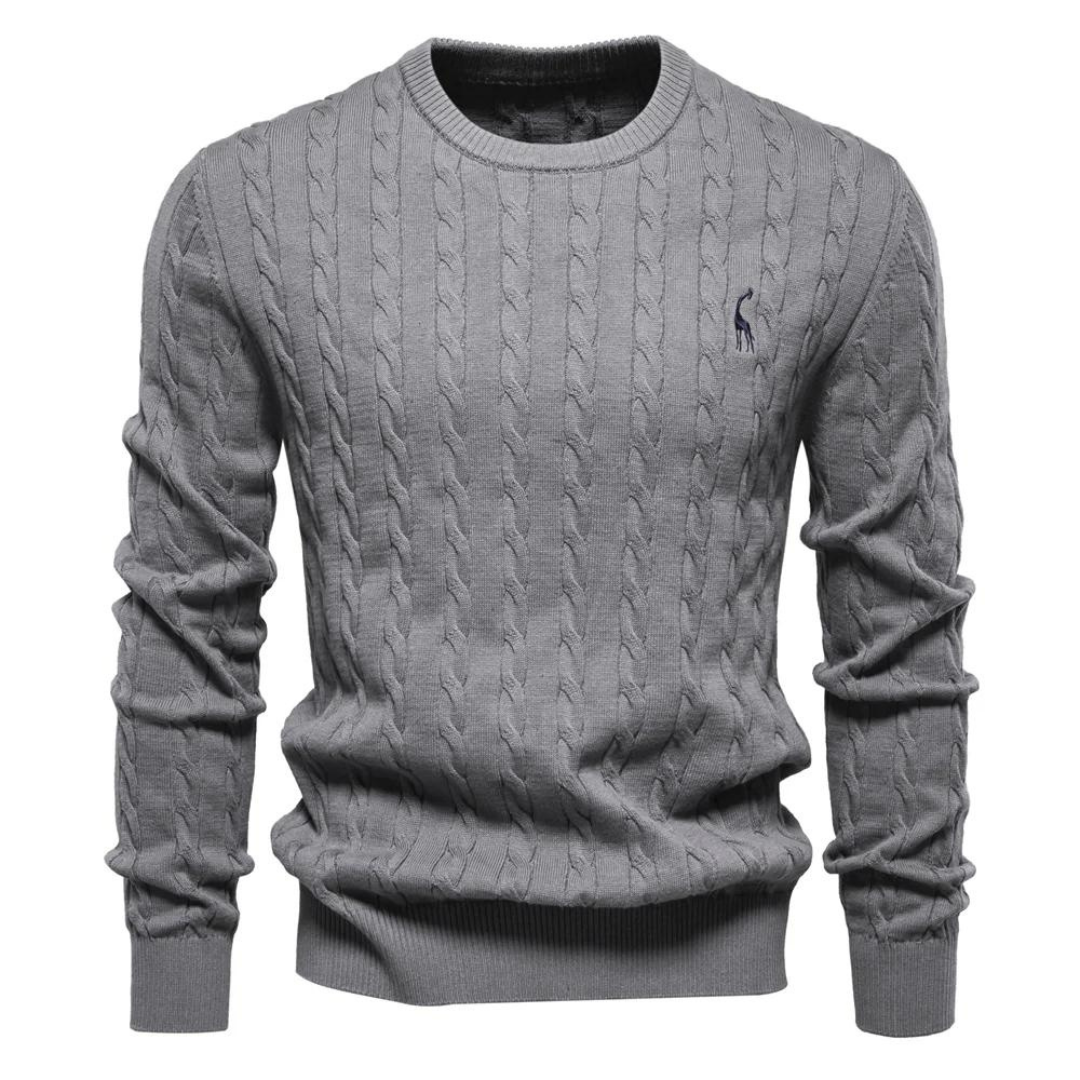 Cream cable knit crew neck sweater with ribbed trim and soft textured pattern for effortless layering