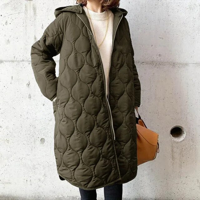 Women's oversized quilted parka coat hooded knee-length design in neutral winter style