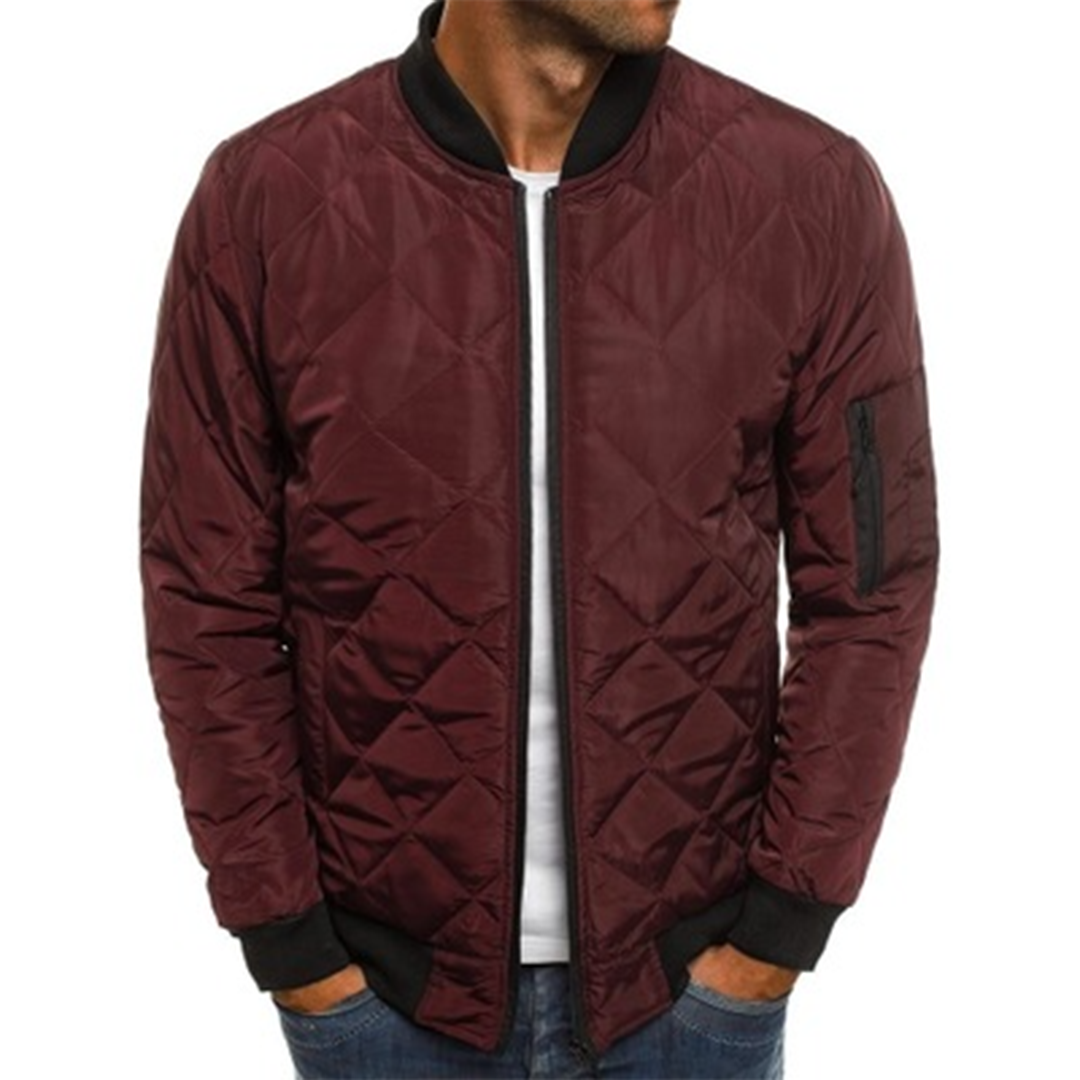 Men's navy quilted bomber jacket with diagonal pattern, rib-knit collar and lightweight streetwear fit