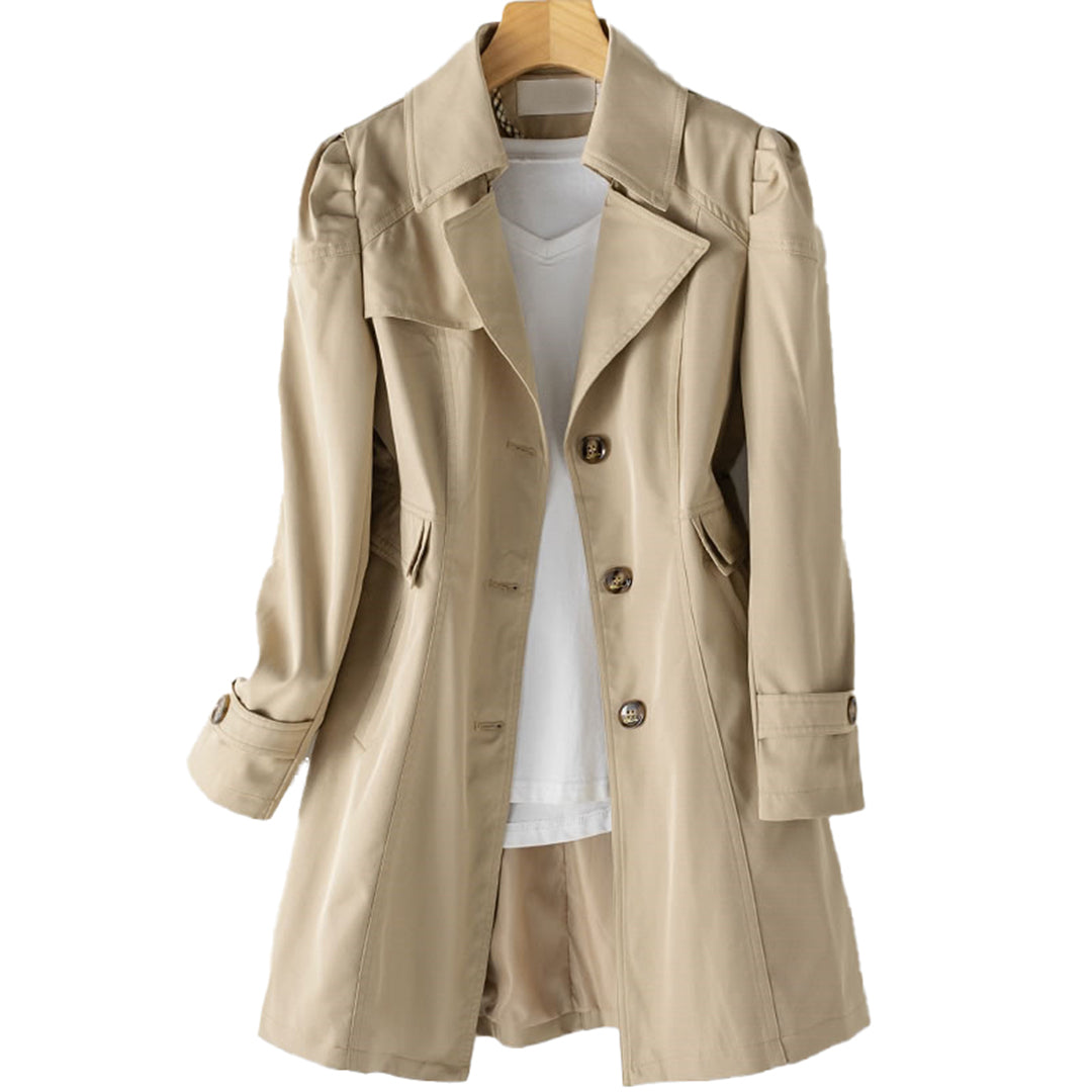 Women's beige double-breasted trench coat tailored silhouette with structured button front closure