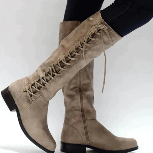 Women's black lace-up knee-high boots with sleek silhouette and front lace detail