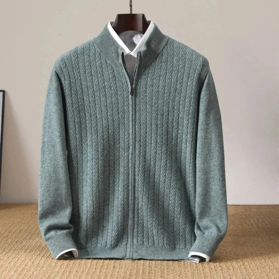 Navy blue wool zip-up cardigan with herringbone knit texture, stand collar, and ribbed cuffs